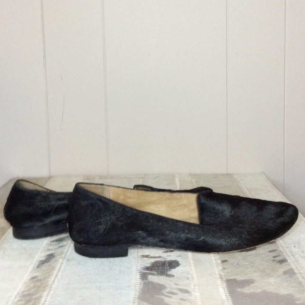 Black cowhide flats